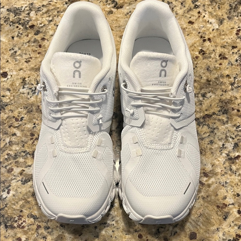 On Running All-White Athletic Shoes